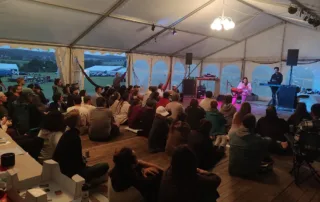 Audience at the City of Seekers festival enjoying a live performance.