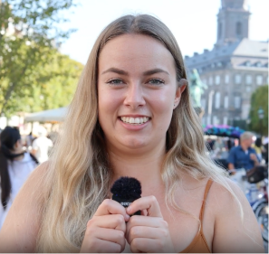 a women with long blond hair, speaking up about how her day was the app adventure , at the yes fam adventure